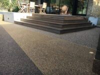 resin-driveway-with-wooden-patio-floor